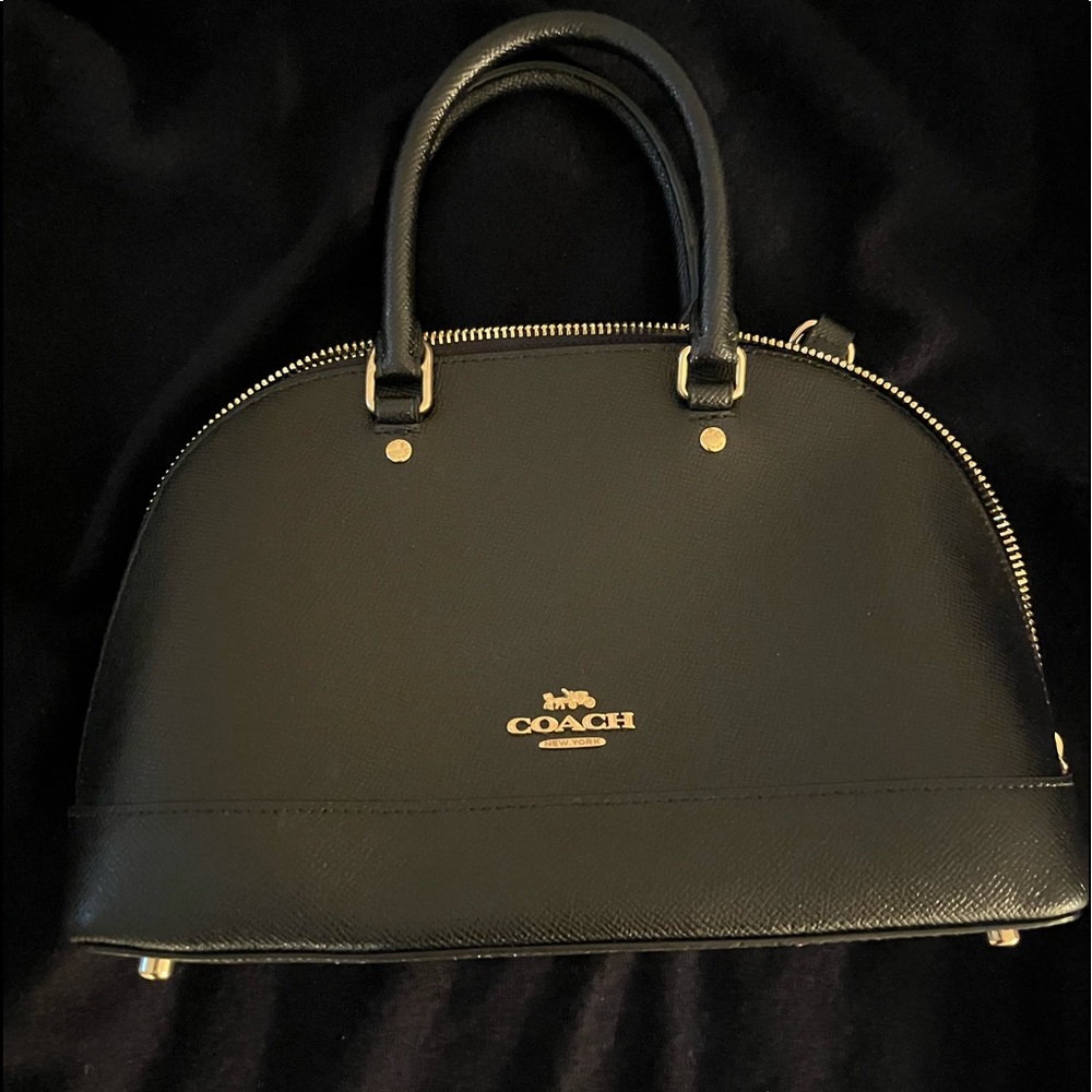 Brand new black coach purse with tags on.
